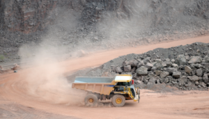 Why should we dust control on unpaved mining roads?
